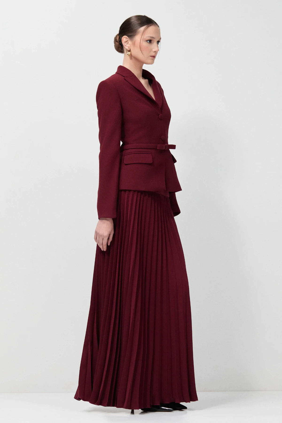 Burgundy pleated skirt with fitted black blazer